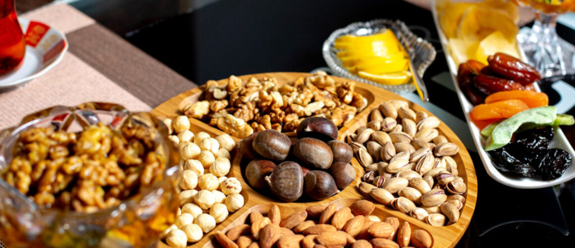 wooden plate with lots of various nuts